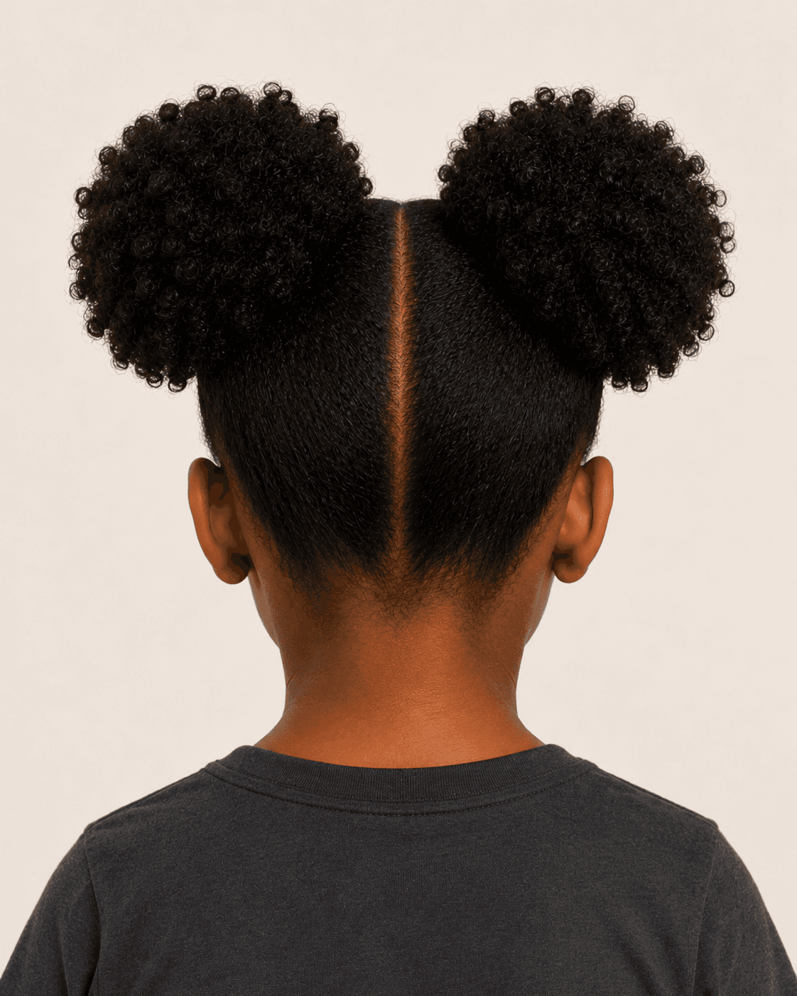 Rear view of double curly puffs showing the center part and symmetry