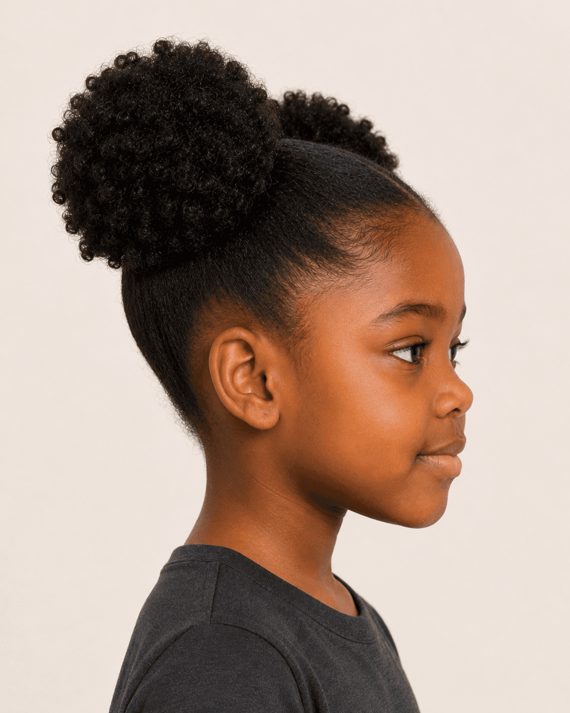 Side profile of double curly puffs