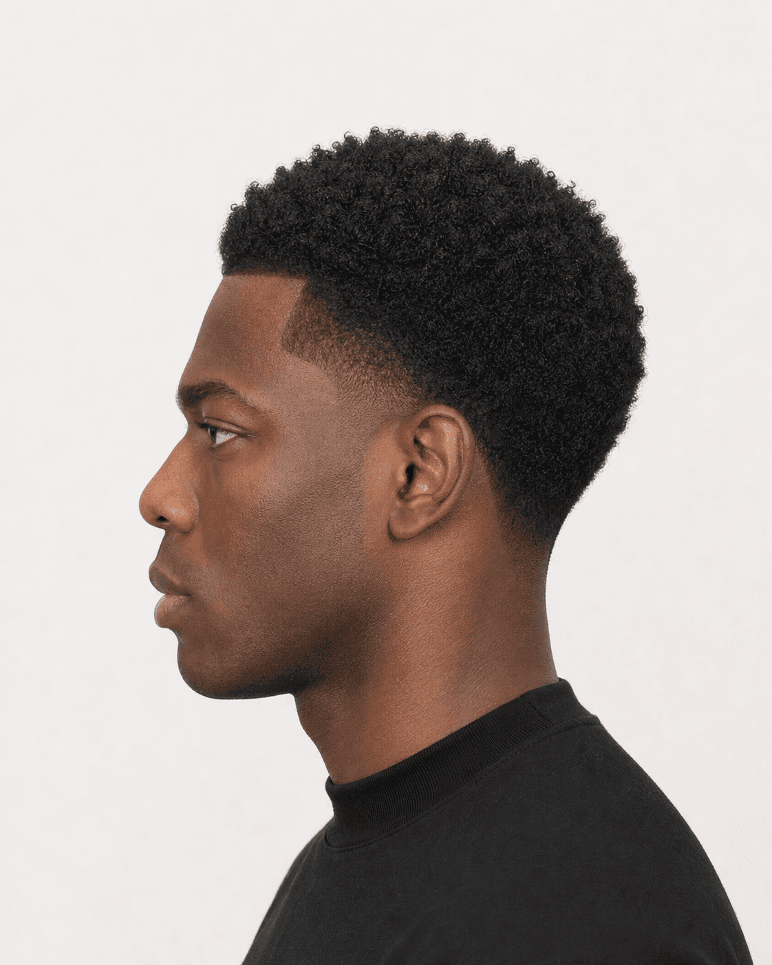 Side profile of a true low taper showing short 4C top, dense side bulk, and localized temple gradient