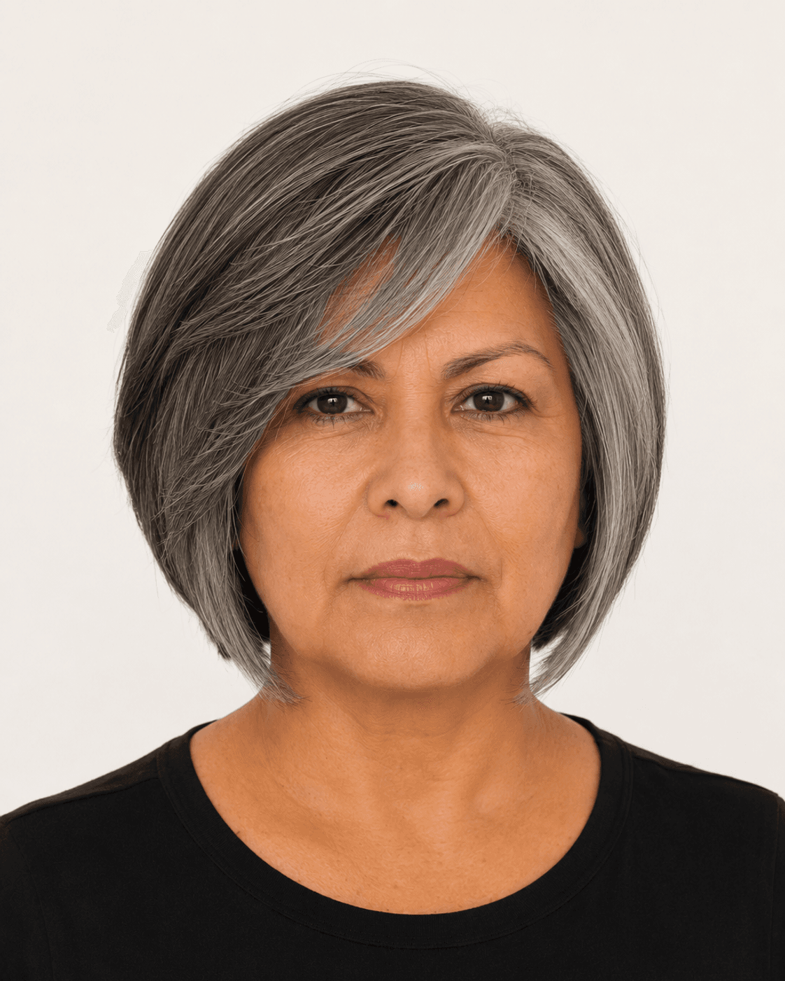 Front view of a modern layered bob with a deep side part and side-swept fringe