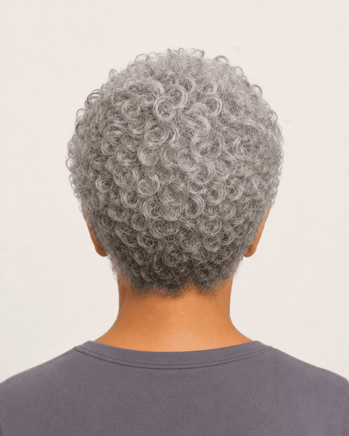 Rear view of natural silver curls showing crown volume and cropped nape