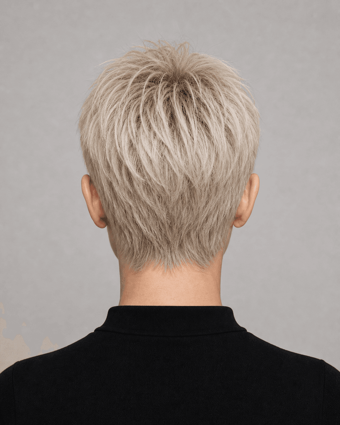 Rear view of a platinum textured pixie showing layered crown and softly tapered natural nape