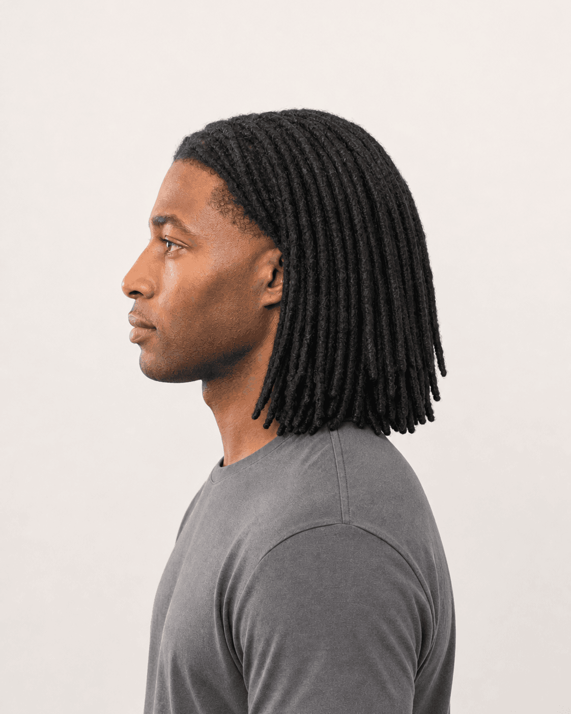 Side profile of shoulder-length locs showing crown density and natural fall