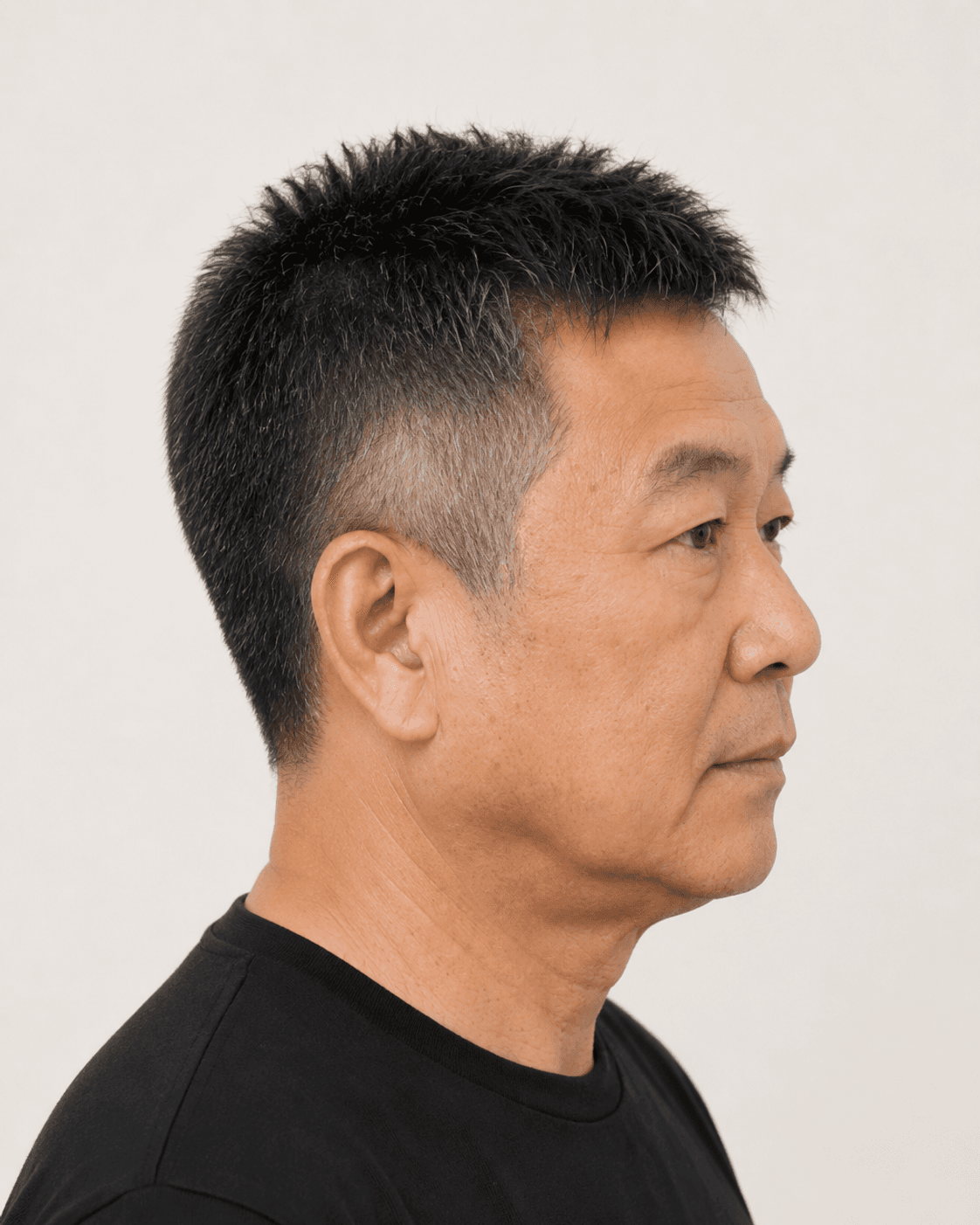 Side profile of a textured crew cut showing the side trim and ear contour